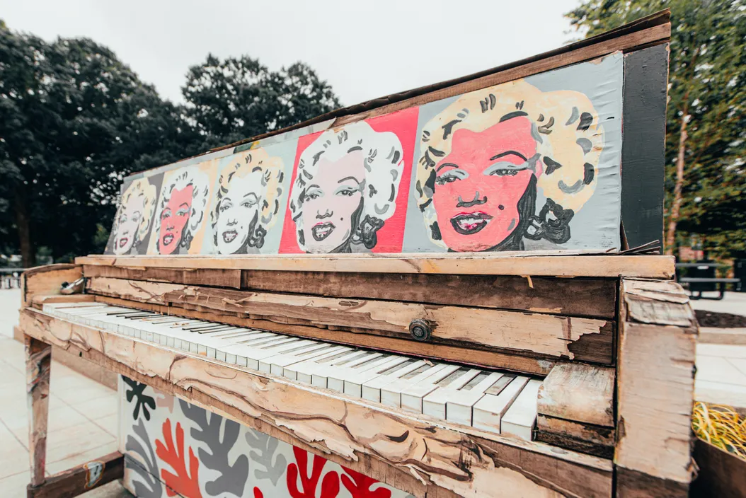 An old piano with Marilyn Monroe's face